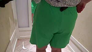 a hidden camera in the fitting room caught a mature chubby milf with a big booty trying on shorts.