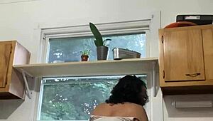Hey, check this Latina milf enjoying herself while doing the dishes.