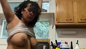 Hey, check this Latina milf enjoying herself while doing the dishes.