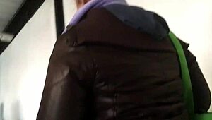 Spying on a chubby girl touching her brown nylon jacket on the street