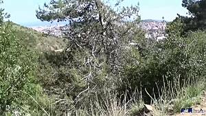 little spanish brunette milf rides big cock in the mountains, sucking it deep under the sun.