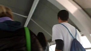 Spying on a chubby girl touching her brown nylon jacket on the street