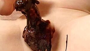 Japanese gay couple cooking chocolate banana in steamy scene