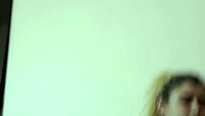 Blonde teen gives blowjob in the kitchen