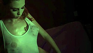 Ava Parker, petite redhead teen, competes in a sensual wet t-shirt game with her lover.