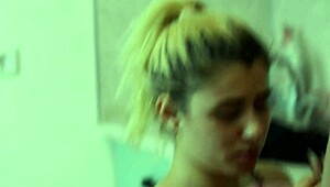 Blonde teen gives blowjob in the kitchen