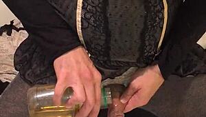 Golden piss flows from dirty old drunk