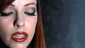 Hot woman gets her wet pussy probed in a kinky scene