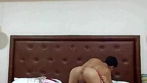 A girl in lingerie has sex with a man while using a toy on herself