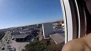 Sarada exposes big tits naked at hotel window near airport