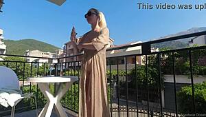 Nude in Public on Balcony Overlooking Busy Road