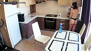 Is that big tits beauty cleaning the kitchen?