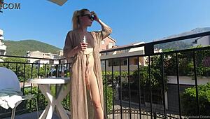 Nude in Public on Balcony Overlooking Busy Road