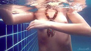 blonde pool babe wendy dives nude for a stunning underwater swim show