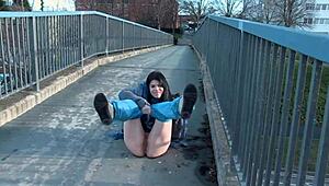 Naughty babe strips and pisses right on public street