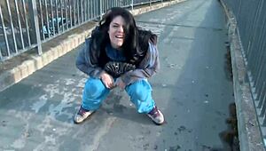 Naughty babe strips and pisses right on public street