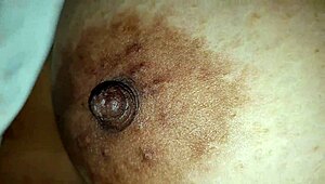 Squeezing Step-Mom's Big Nipples