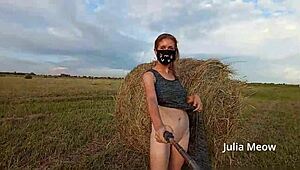 Young girl Juli Smith undressing in a field