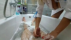stepmom walks in to wash naked stepson, ignores huge cock in bathroom