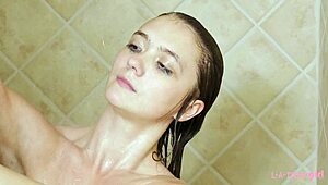 Charming Brunette Model Strips and Showers for Photoshoot