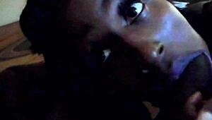 Ebony woman sucking big black cock passionately