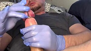 Flexible guy masturbates with plug