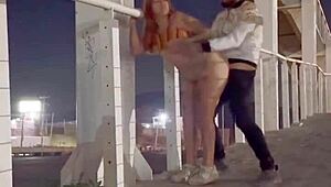 Couple enjoying intimacy on the bridge