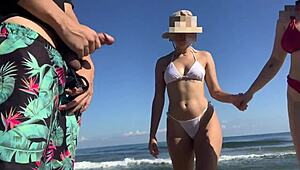 Two unknown girls catch me masturbating on the beach. I invite them to help with my cock!