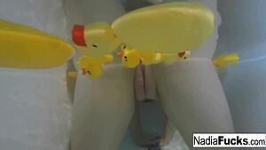 Does sexy Nadia masturbate in the bath with rubber duckies?