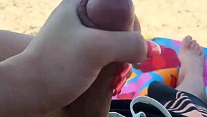 Public beach holiday turns into a steamy blowjob and handjob scene