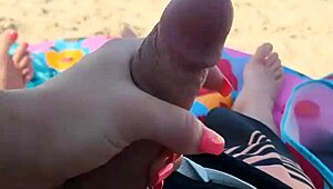 Public beach holiday turns into a steamy blowjob and handjob scene