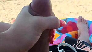 Public beach holiday turns into a steamy blowjob and handjob scene