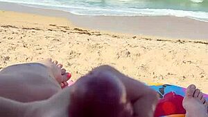 Public beach holiday turns into a steamy blowjob and handjob scene