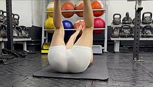 another day at the gym with this brunette bodybuilder getting wet and working out hard.