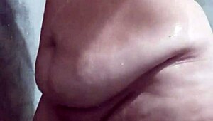 Look at this big-ass Latina taking a steamy shower, wanna join her?