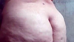 Look at this big-ass Latina taking a steamy shower, wanna join her?