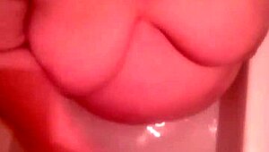 Hot bathtub blowjob and cum on those big natural tits in the bathroom!