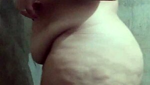 Look at this big-ass Latina taking a steamy shower, wanna join her?