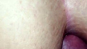 the tip enters her ass for anal fucking