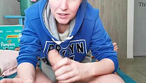 brunette in hoodie skillfully sucking cock in a cute homemade video.