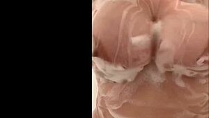 French curvy milf secretly fondles her huge breasts in the shower