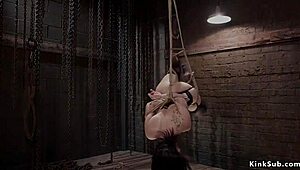 BDSM trainee gets mouthful of cock while trapped in cage