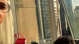 couple banging in the building window for neighbors to watch