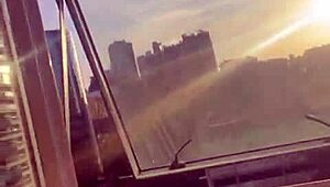 couple banging in the building window for neighbors to watch