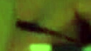 A MILF smokes while spanking her ass and masturbating