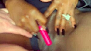 The beautiful black model masturbates with a vibrator for the sake of the white guy