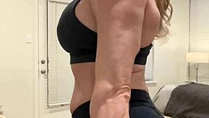 mature housewife bodybuilder flexing muscular body at home