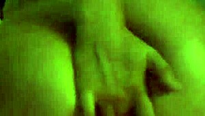 A MILF smokes while spanking her ass and masturbating