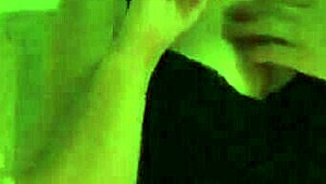 A MILF smokes while spanking her ass and masturbating