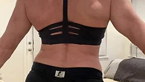 mature housewife bodybuilder flexing muscular body at home